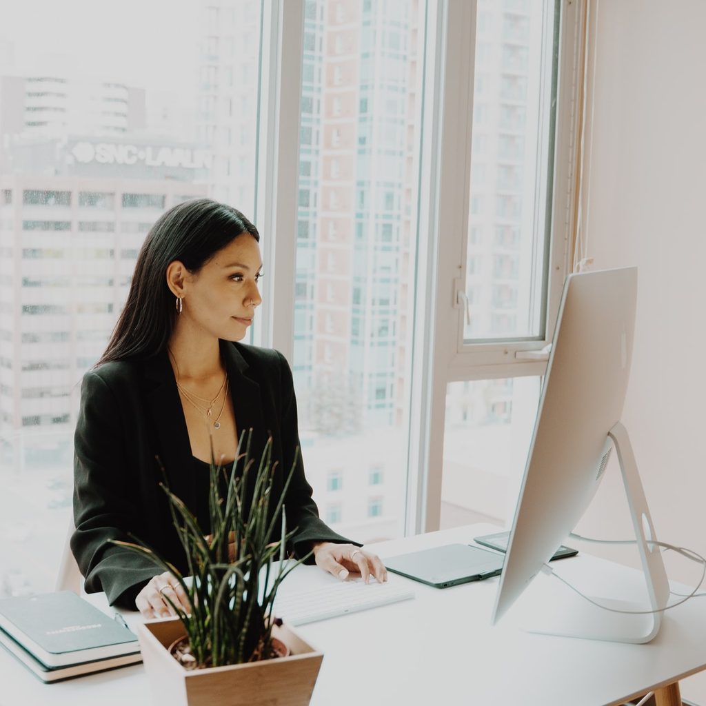 A woman at her desk, working