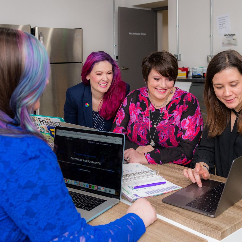 A group of employees at a meeting