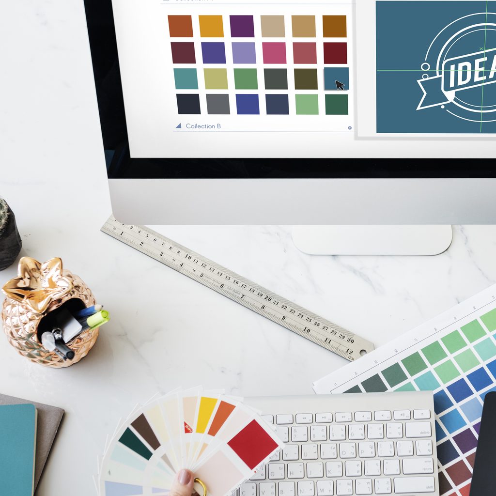 Marketing person holding color palettes on a table