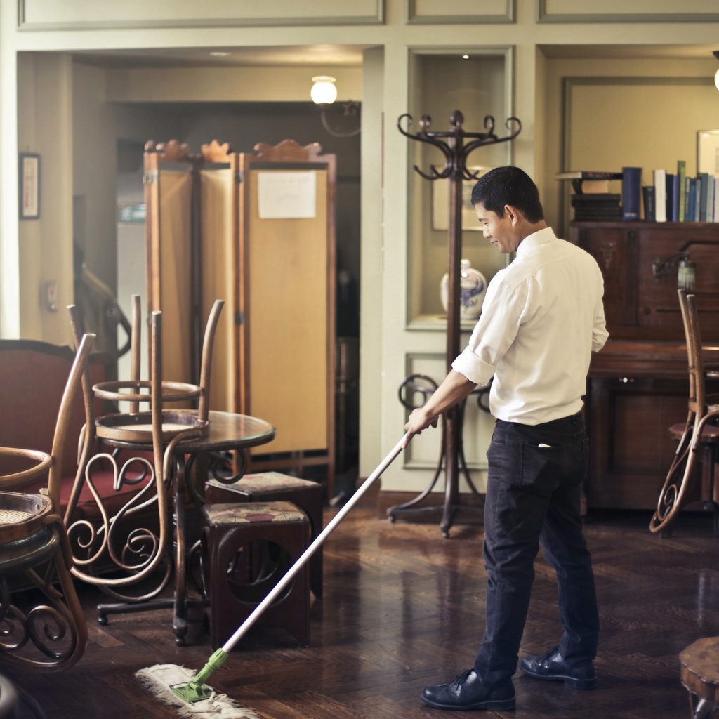 Man cleaning a floor