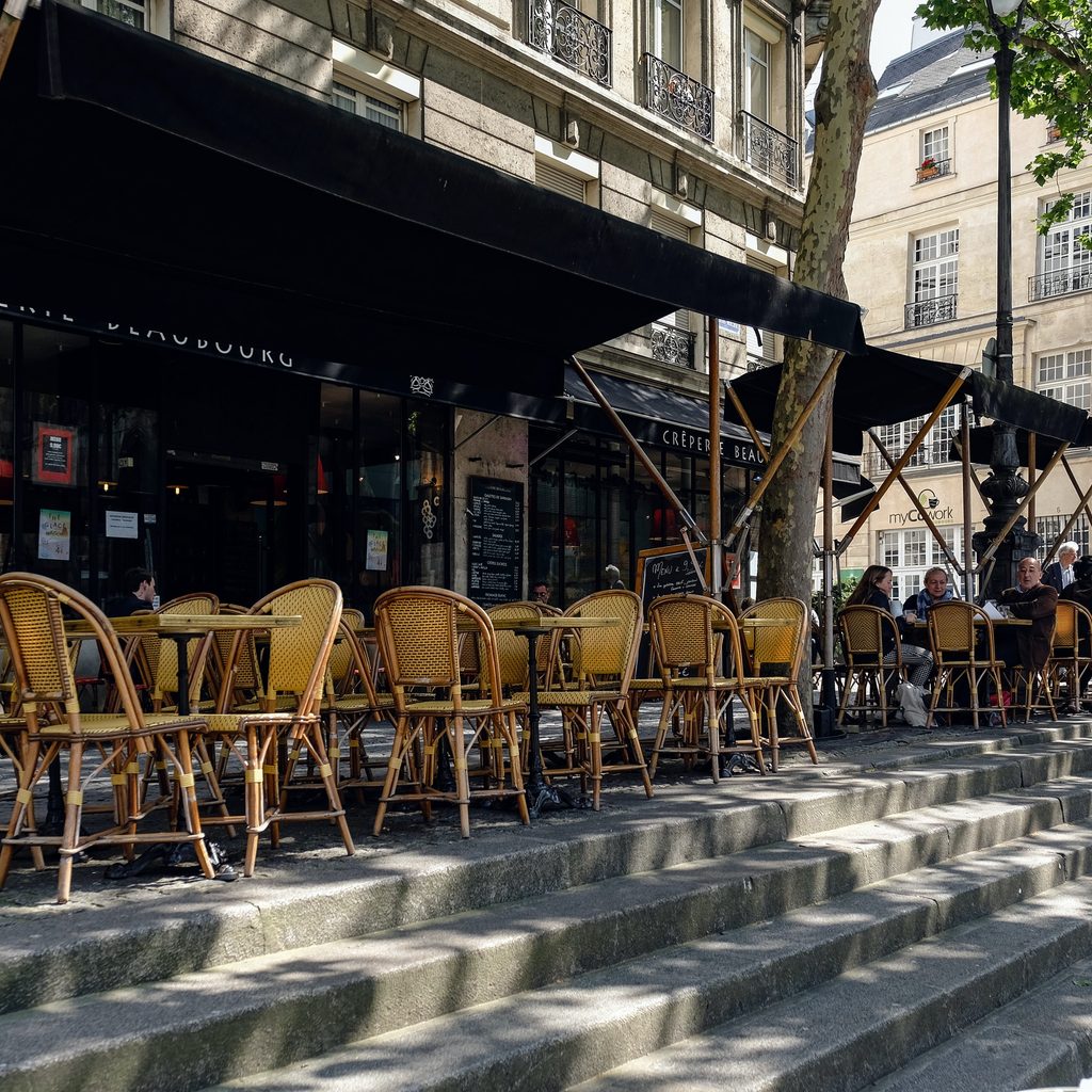 Empty Chairs On Restaurant Patio