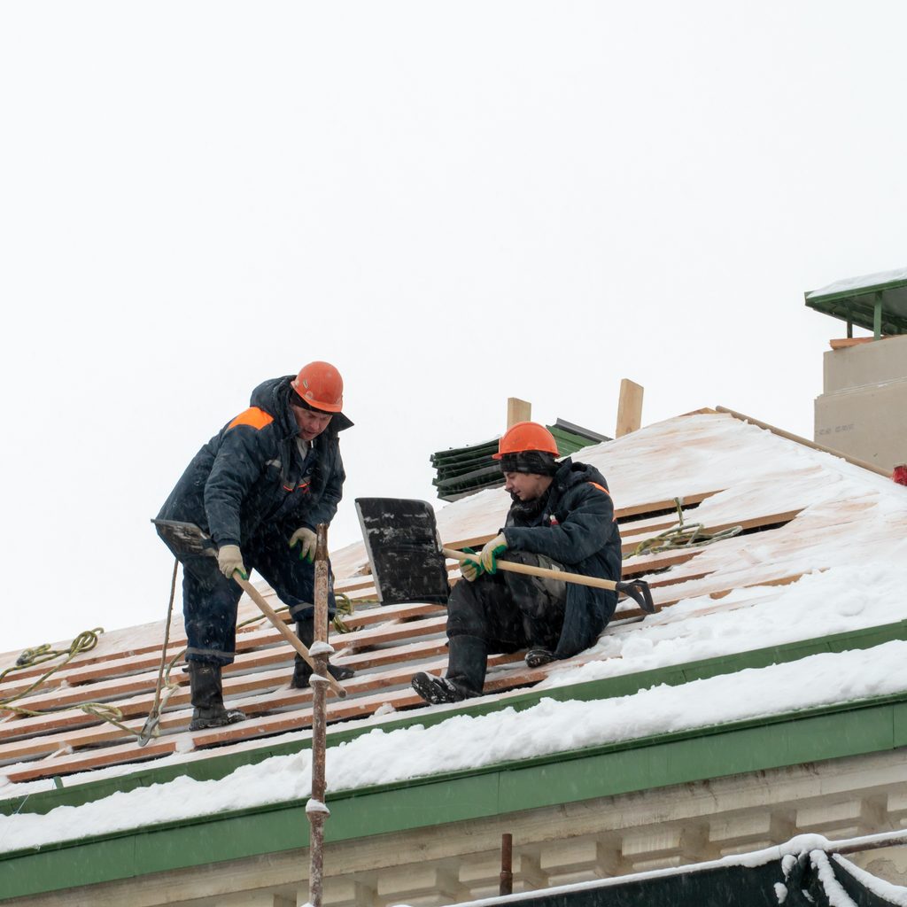 Roofers Working In Winter