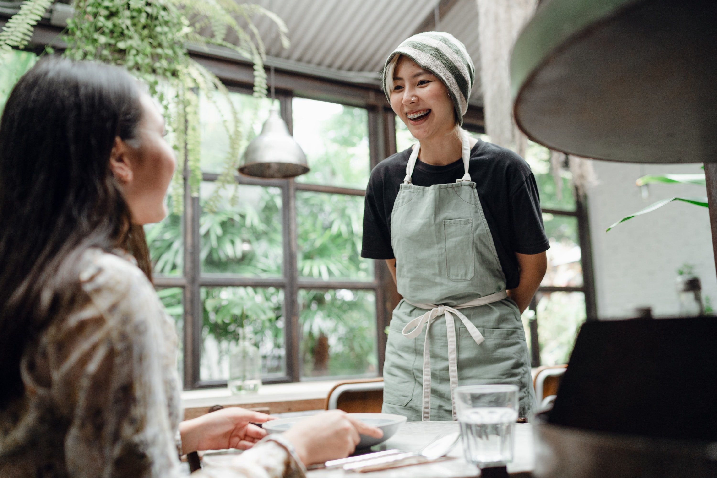 Waitress talking to customer