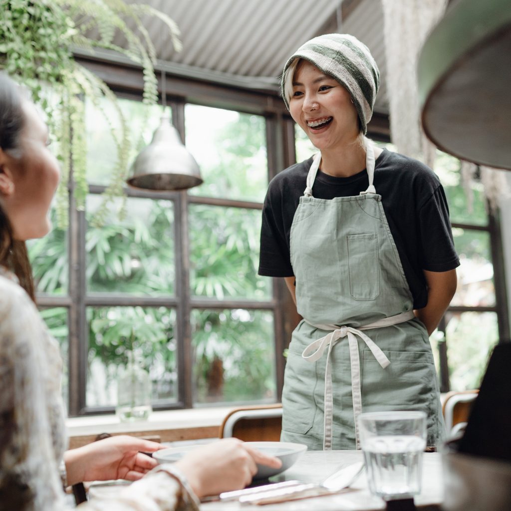 Two Women With Coffee And Pen
