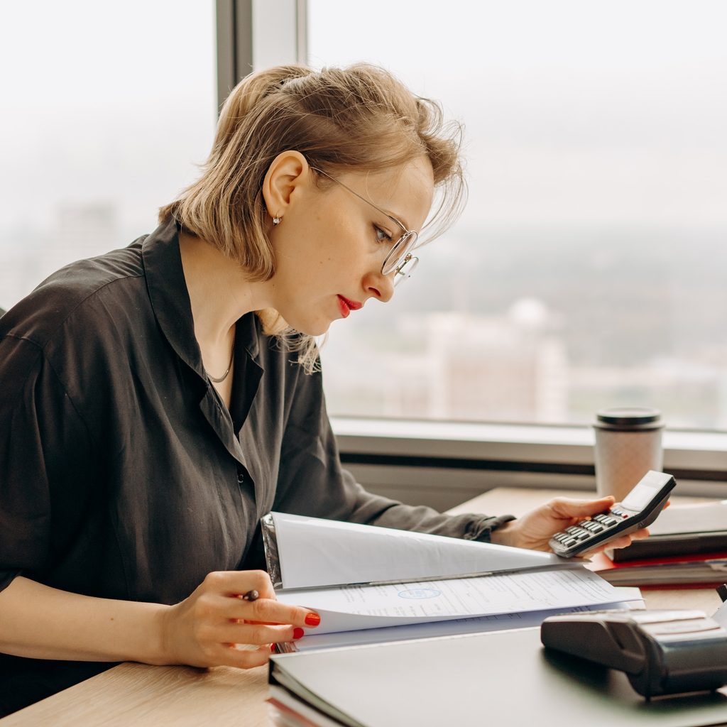 Woman in Black Dress Shirt Using Macbook Air
