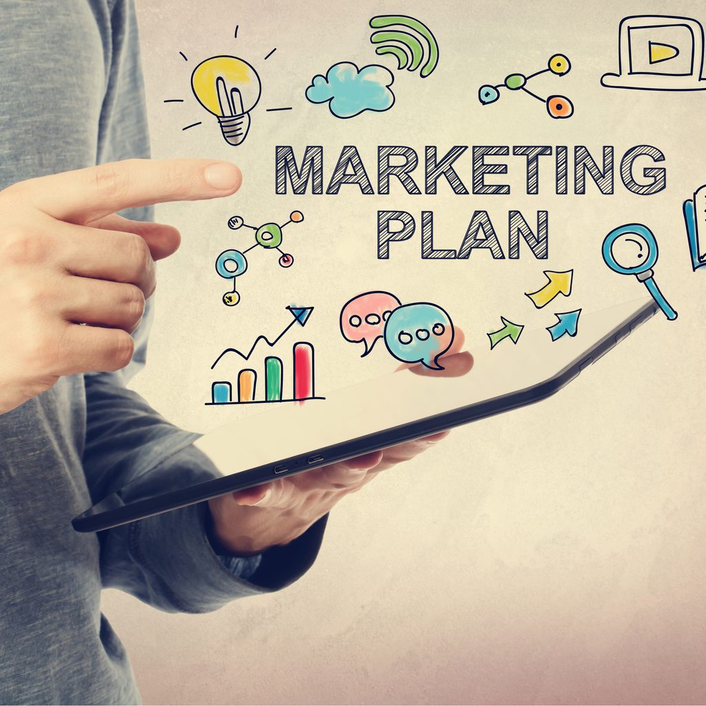 Man pointing at marketing plan graphic