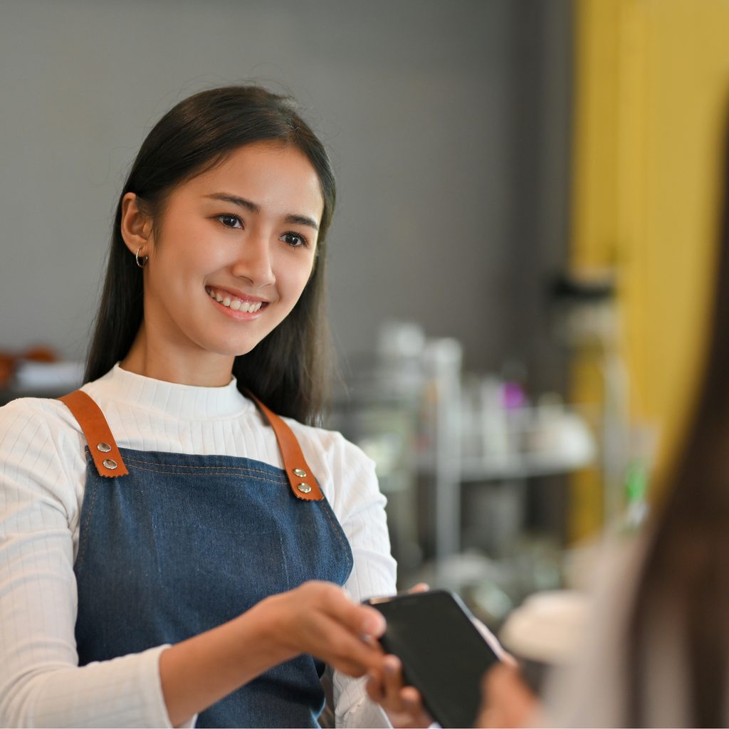 Happy Asian restaurant owner