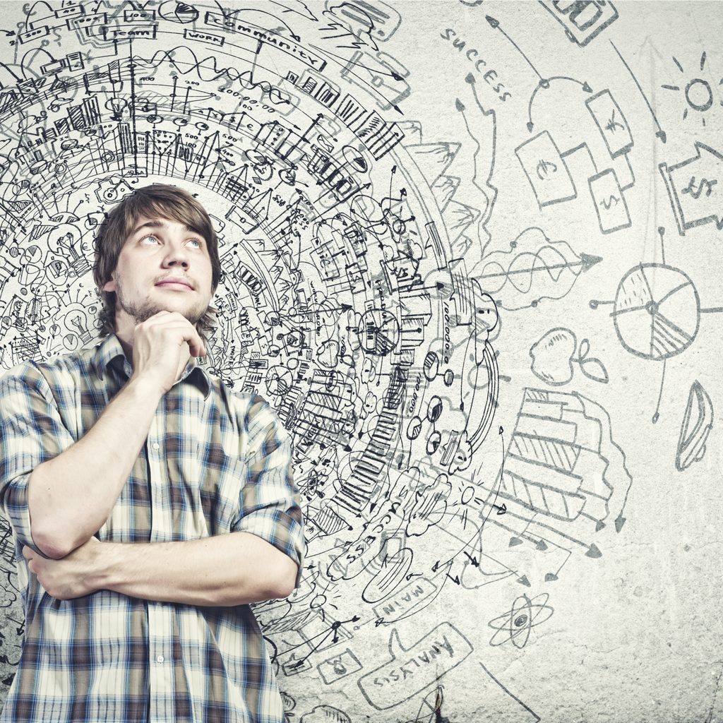 Young man thinking innovatively