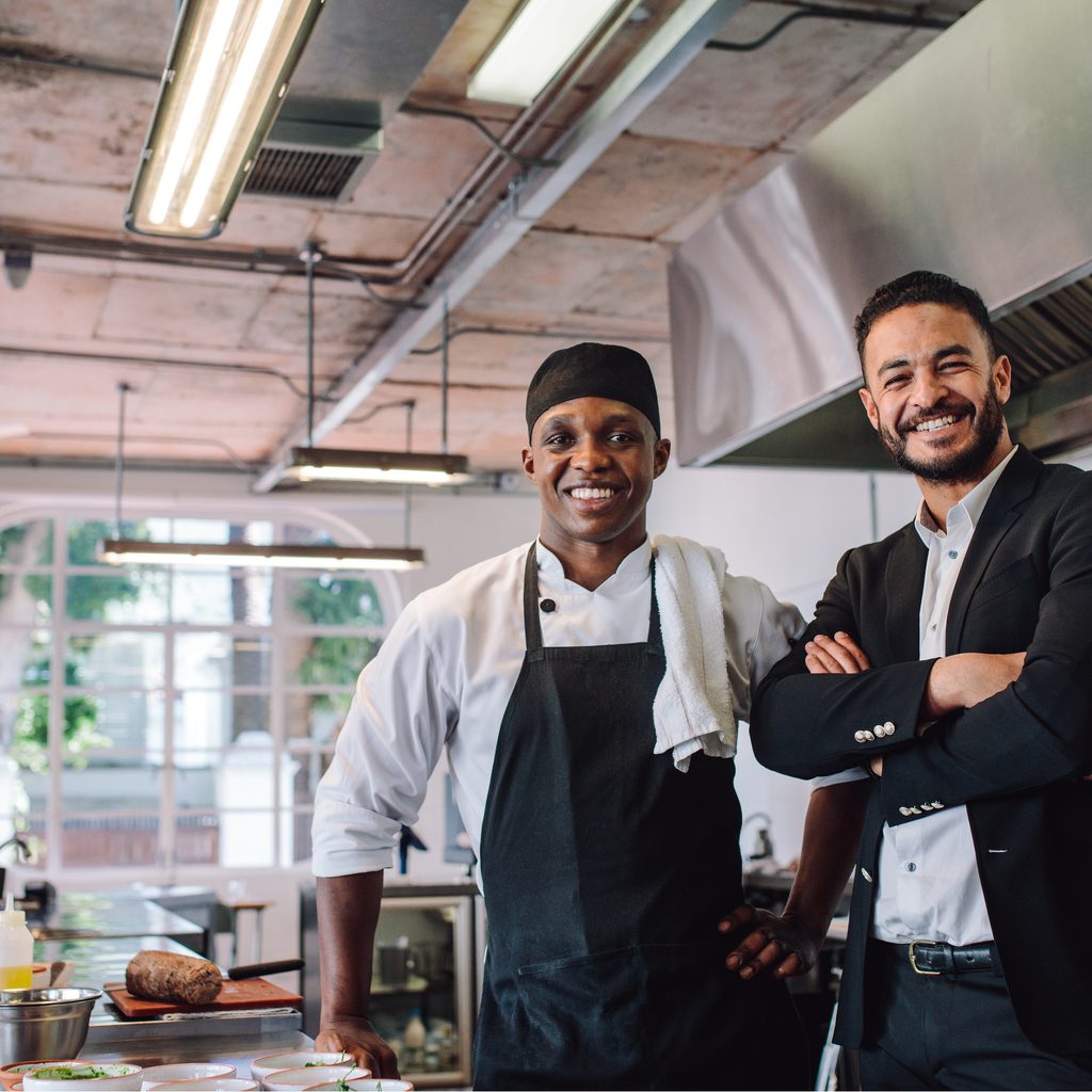 Happy ethnic restaurant owners