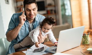 Young remote worker and baby