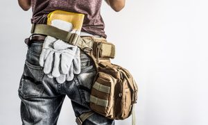 Worker wearing a tool belt