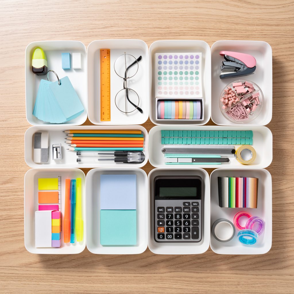 Neatly organized office accessories in desk organizer trays