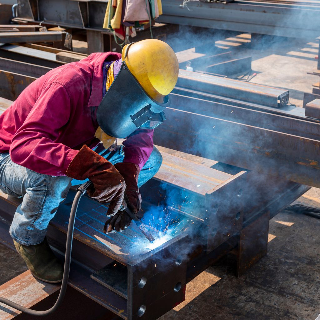 Man with welding shield
