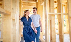 Couple walking through new home.