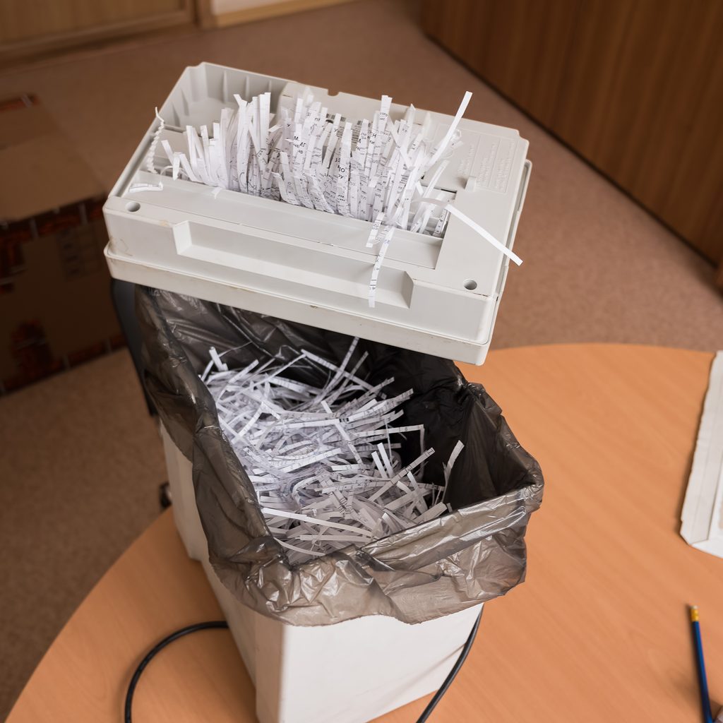 Small paper shredder on a wastebasket