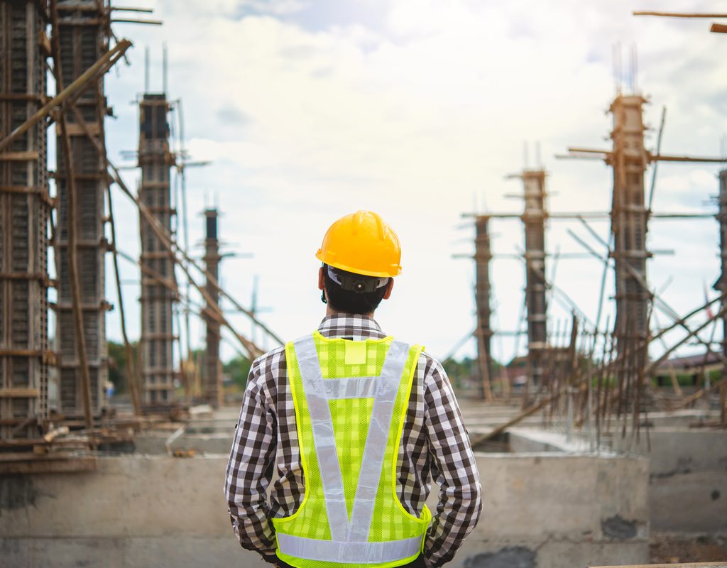 Construction worker overseeing work site