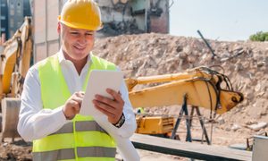 Construction manager working at building site