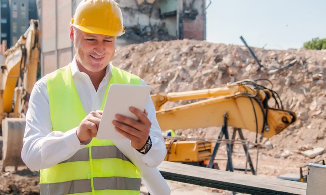 Construction manager working at building site