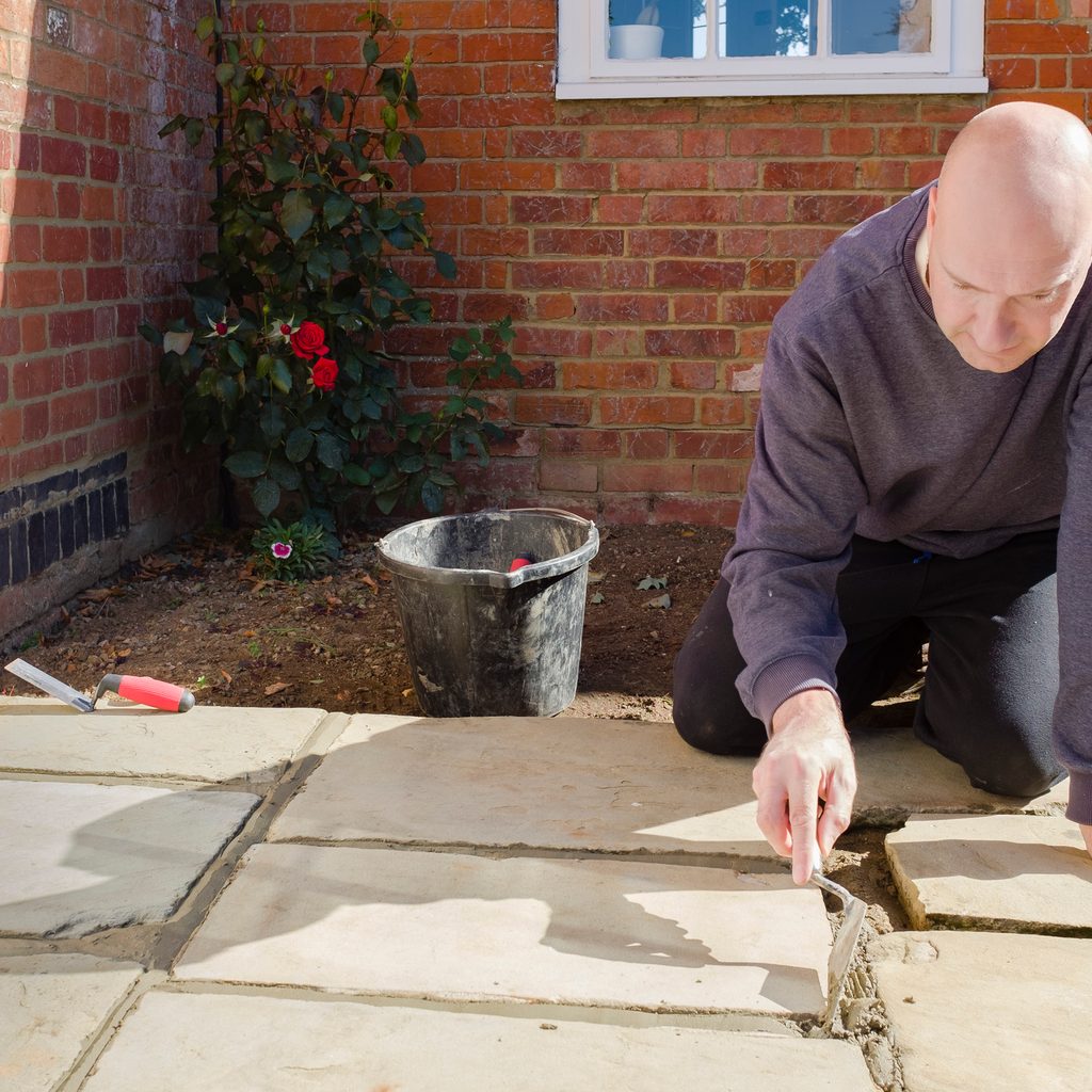 Installing stone slab pavers