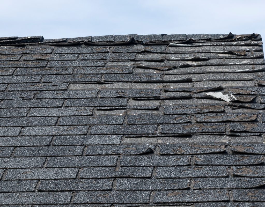 A worn and tattered old roof