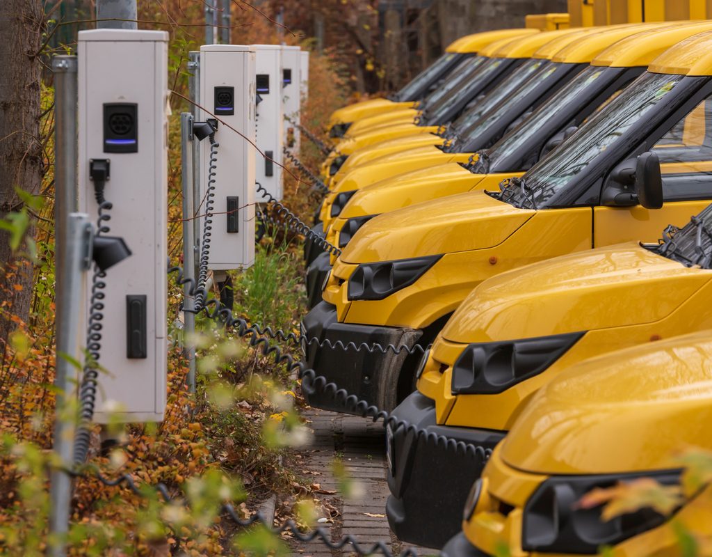Line of EV vans charging
