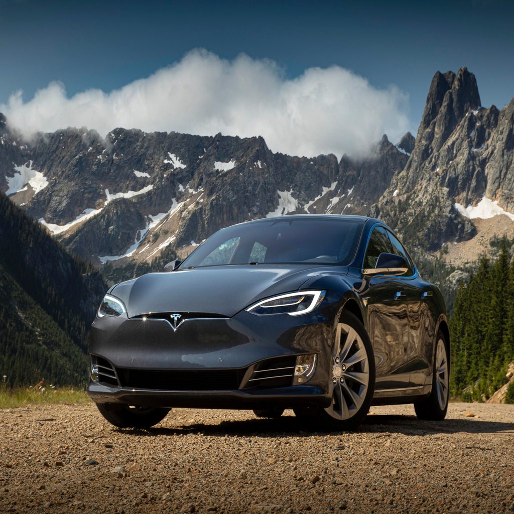 Tesla EV near the mountains