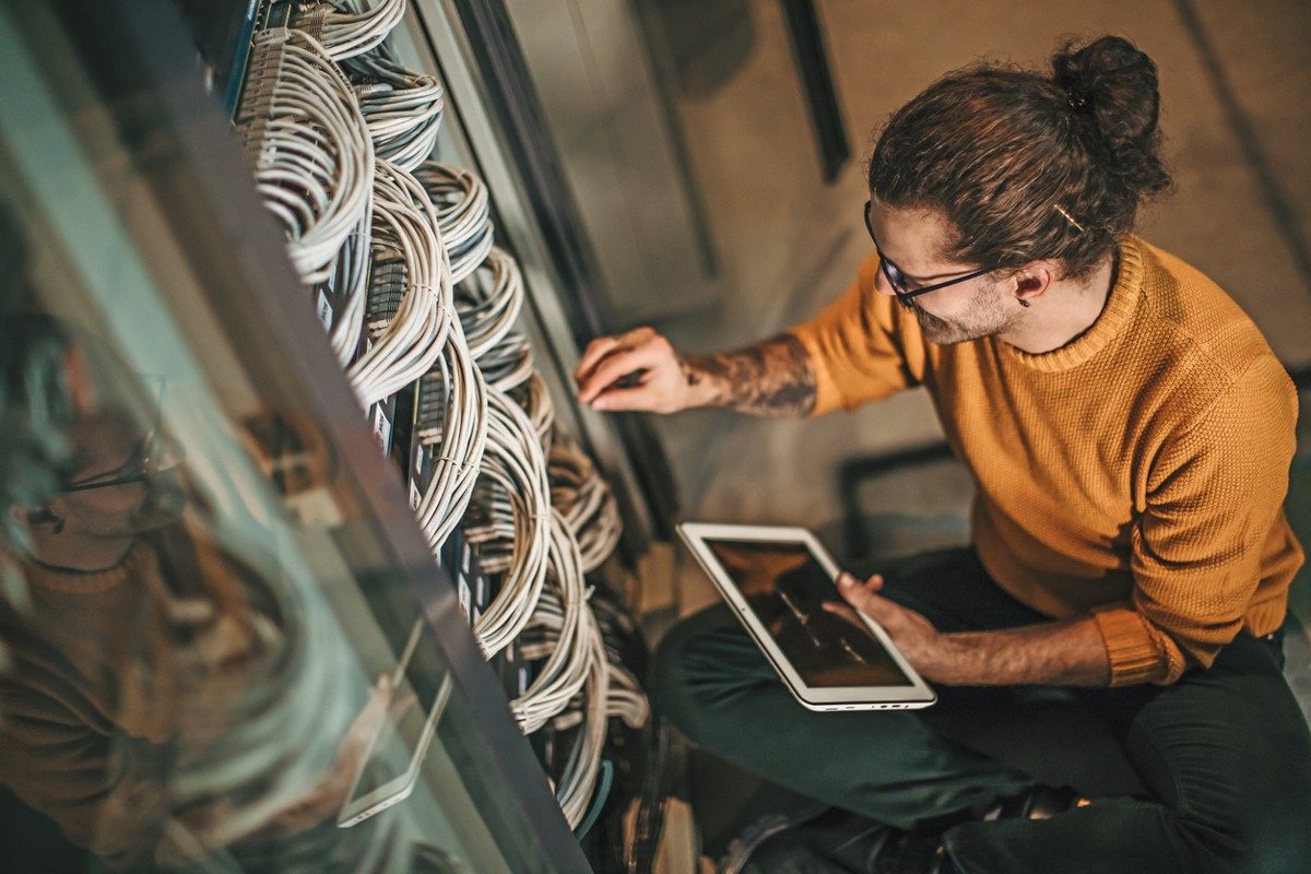 Male Caucasian IT technician in server room