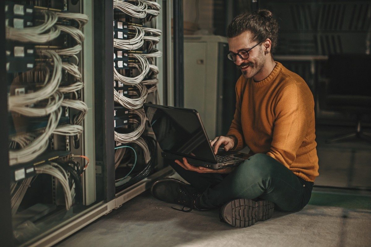 Male Caucasian IT technician in server room