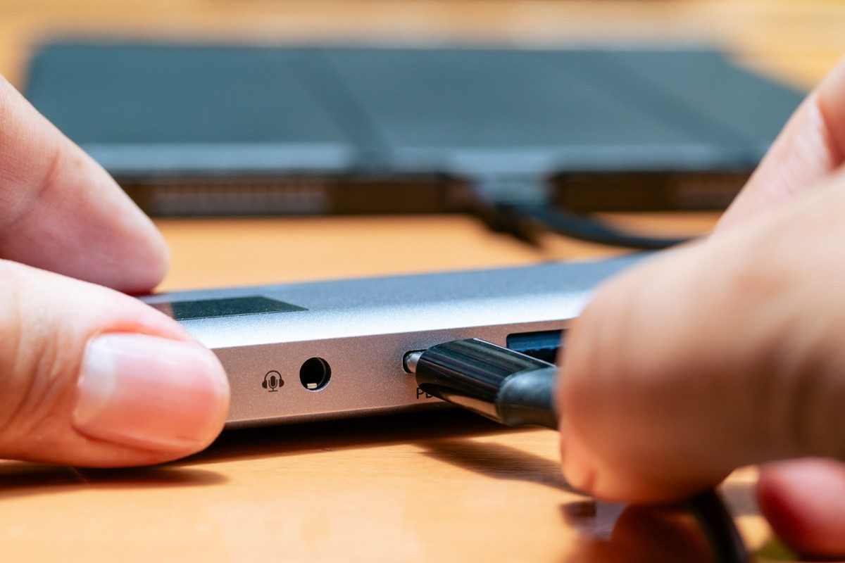 Charging digital tablet with USB C multiport hub with pass-through charging