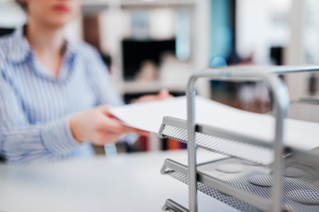 Organizing paperwork on the desktop