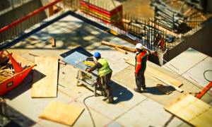 Two men working on construction site
