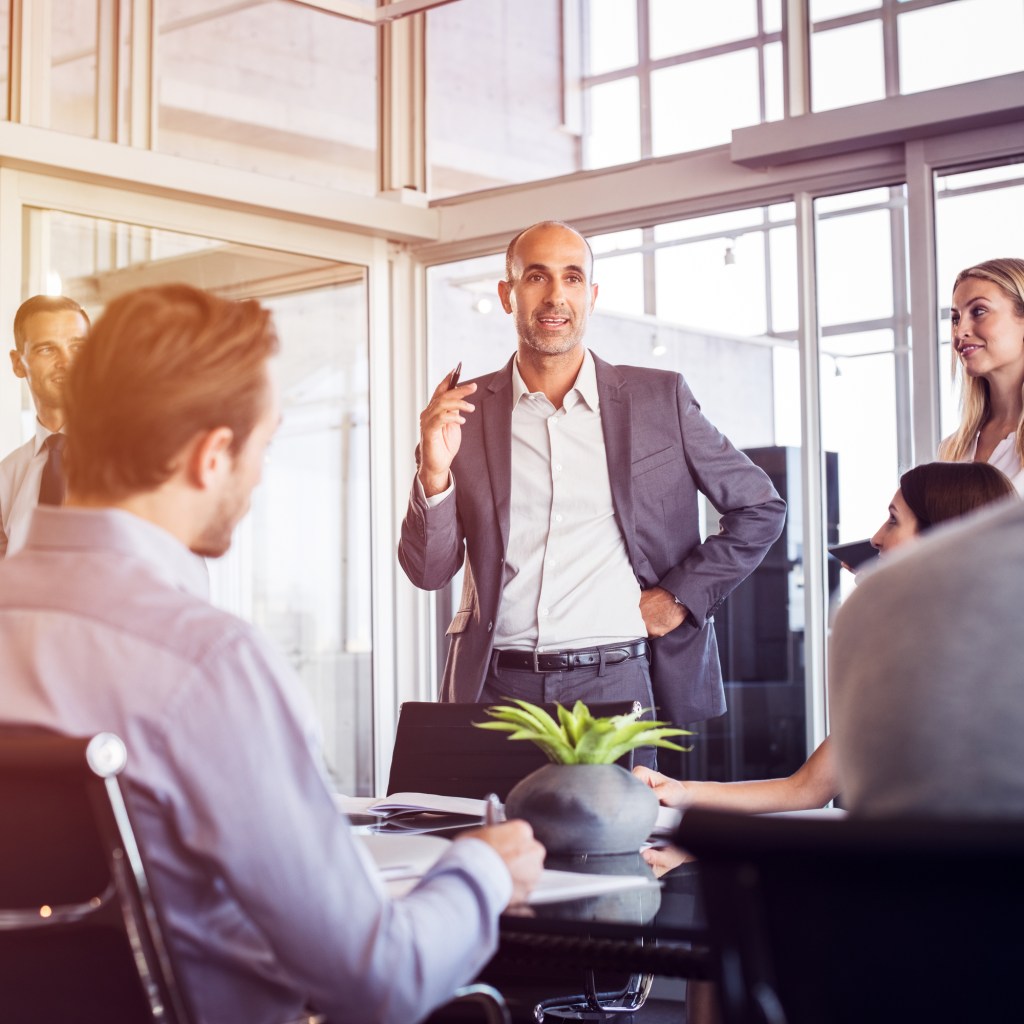 Business leader talking to employees