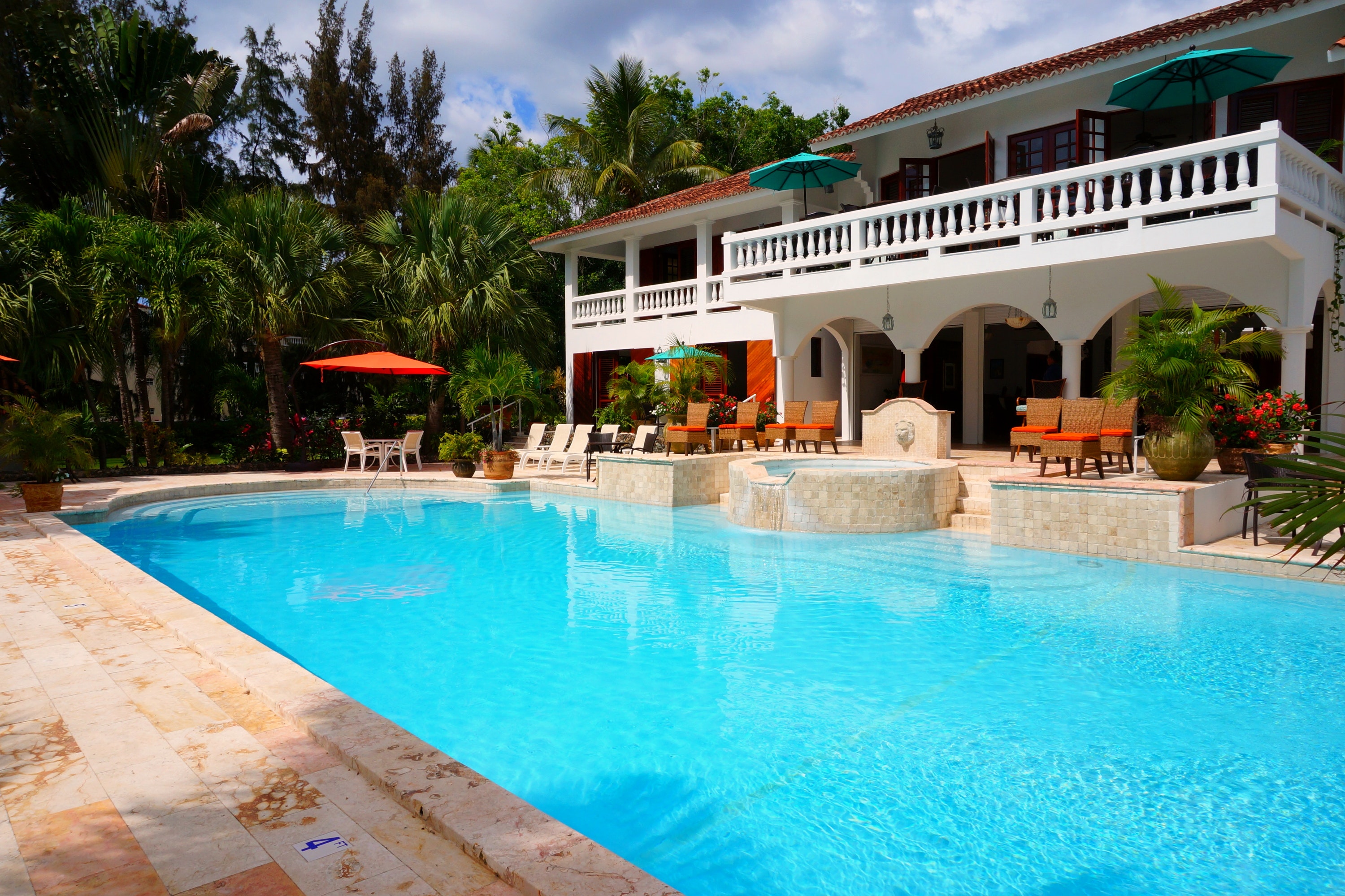 Red Outdoor Chairs Near Swimming Pool