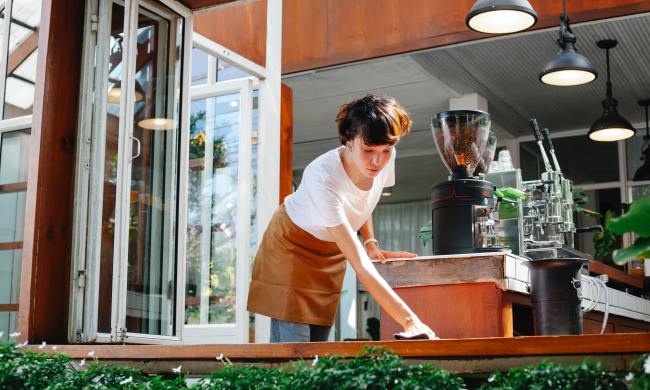 Woman cleaning a windowsill