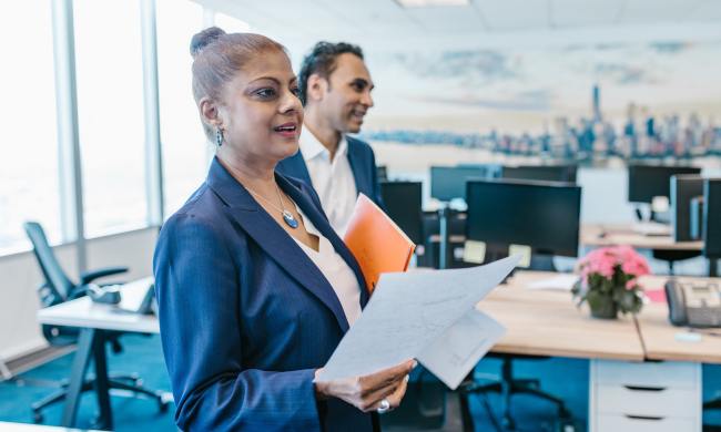 Woman and man with paperwork in an office