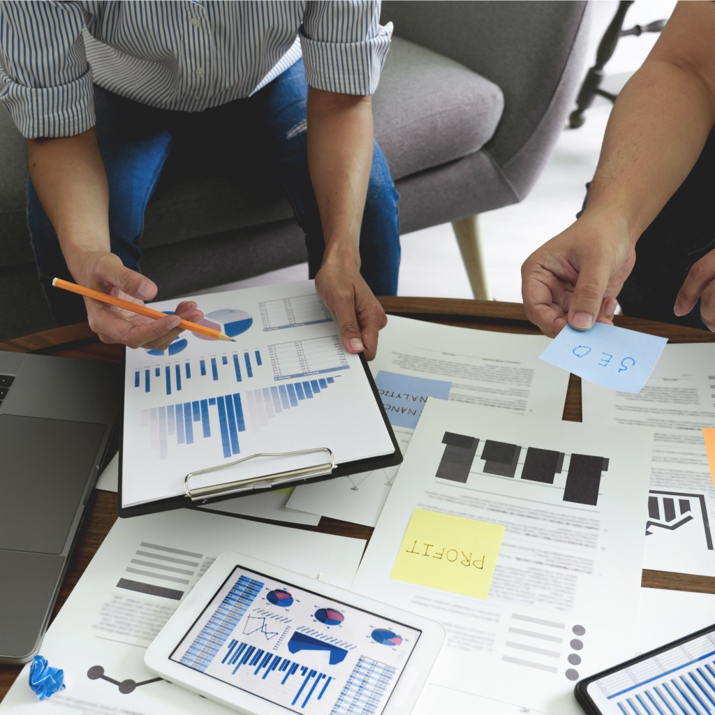 Businesspeople with financing spreadsheets