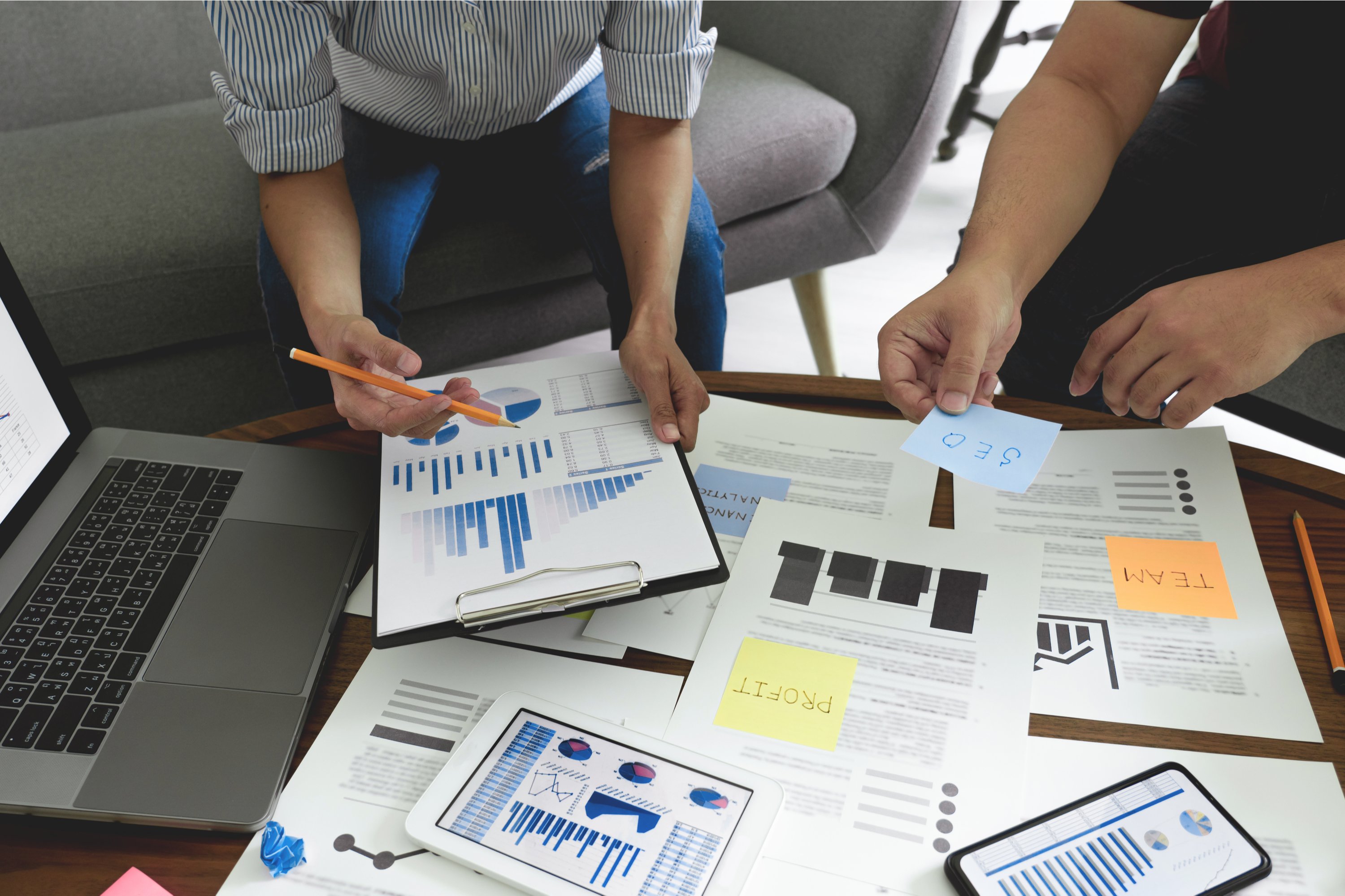 Businesspeople with financing spreadsheets