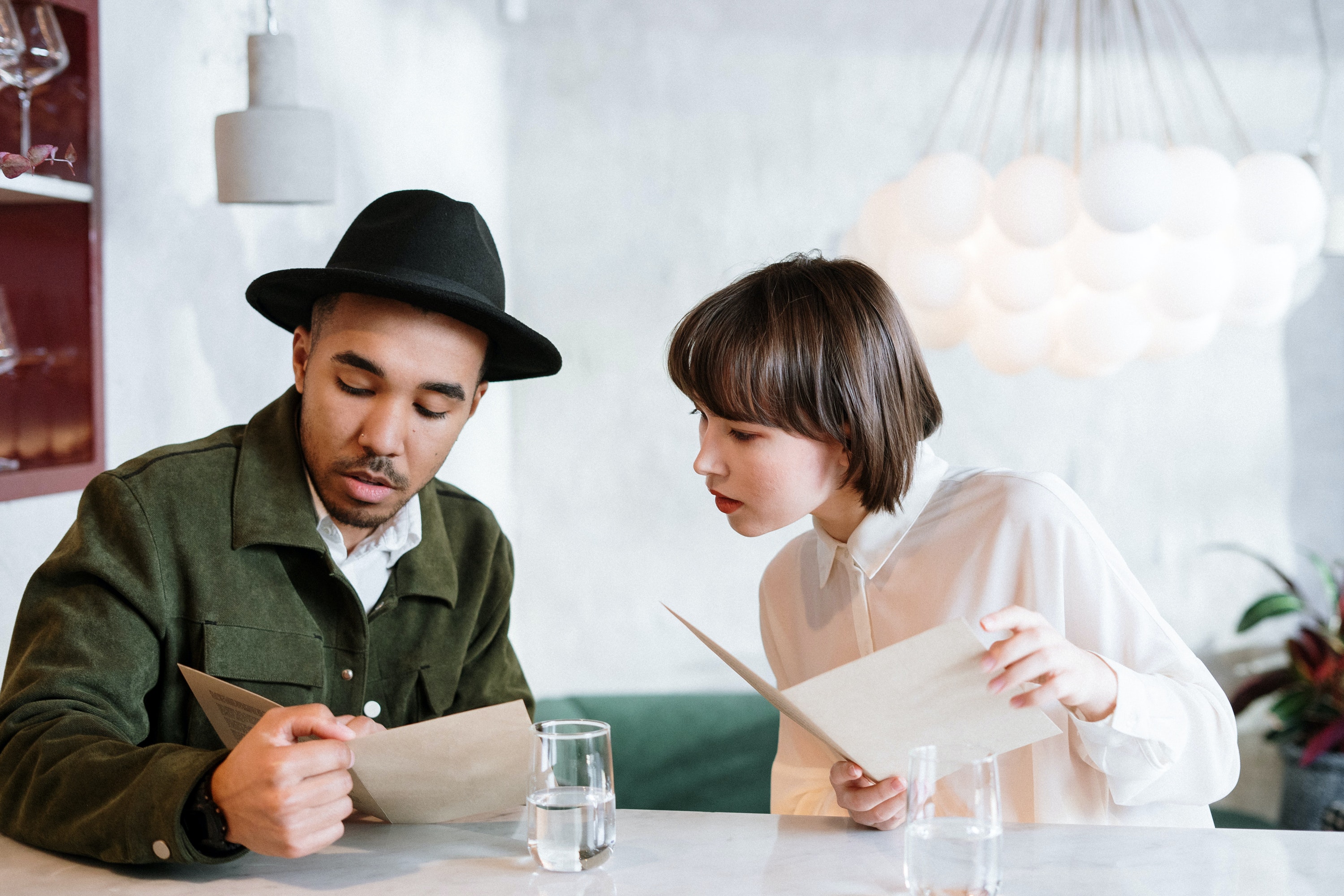 A couple reading a menu together