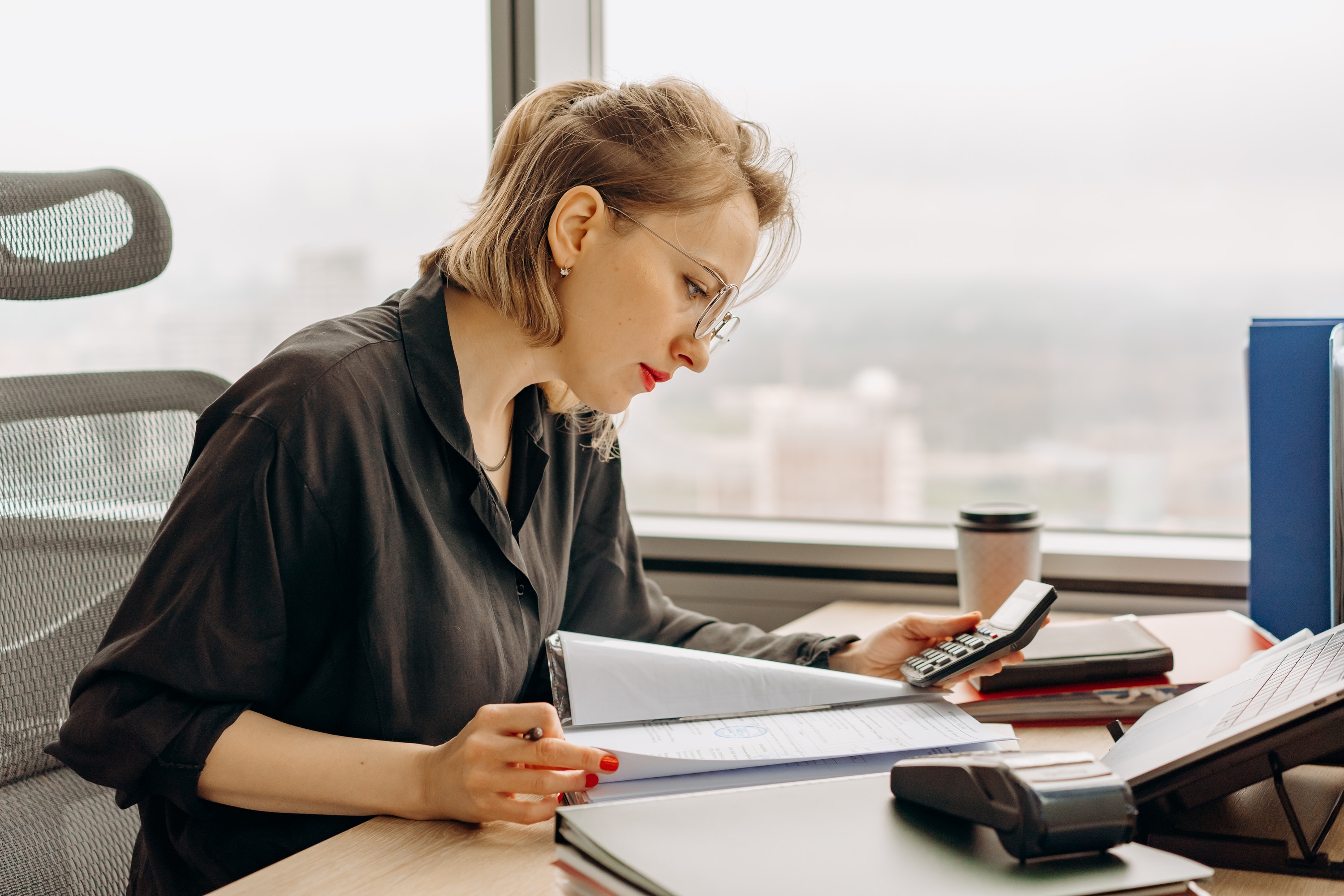 Woman in Black Dress Shirt Using Macbook Air