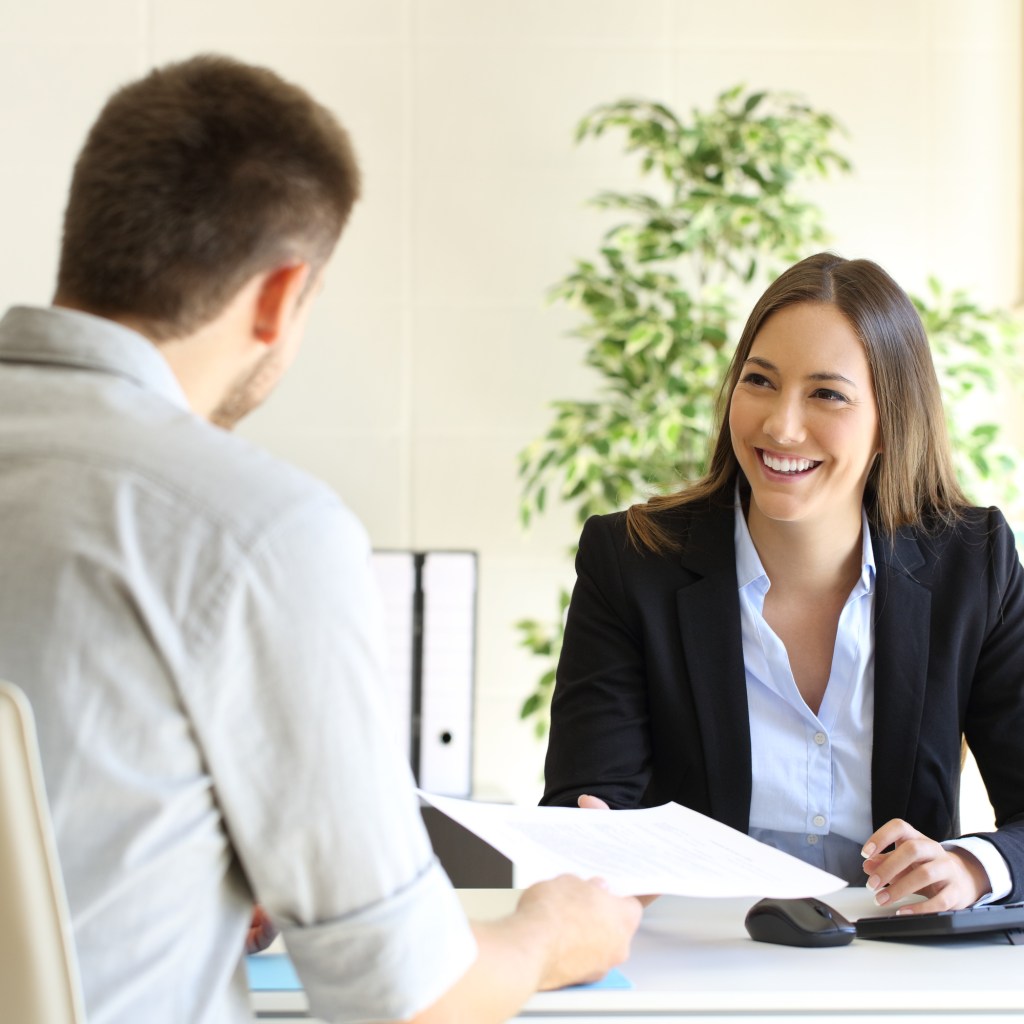Man giving his resume during interview