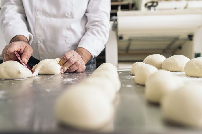 bakery shop business man kneeding dough