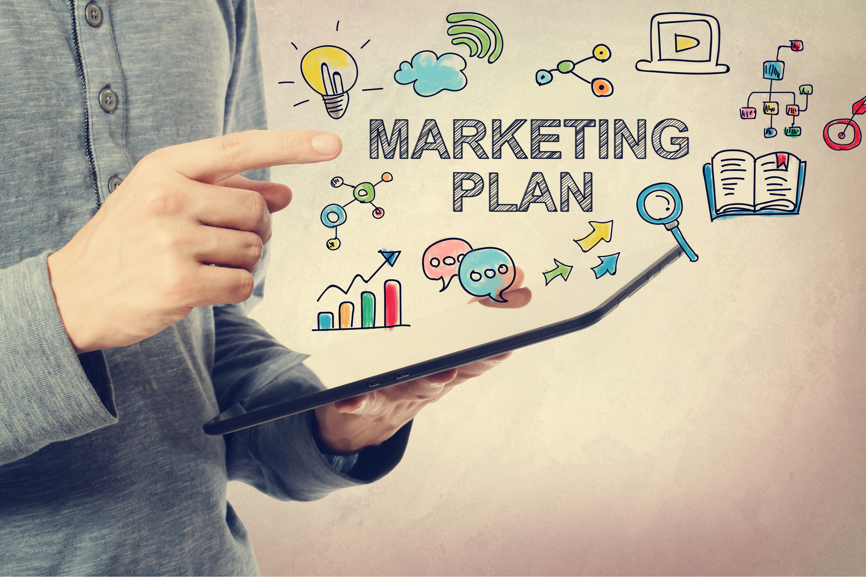 Man pointing at marketing plan graphic