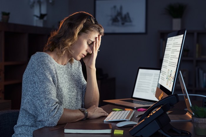 Businesswoman suffering from overwhelm
