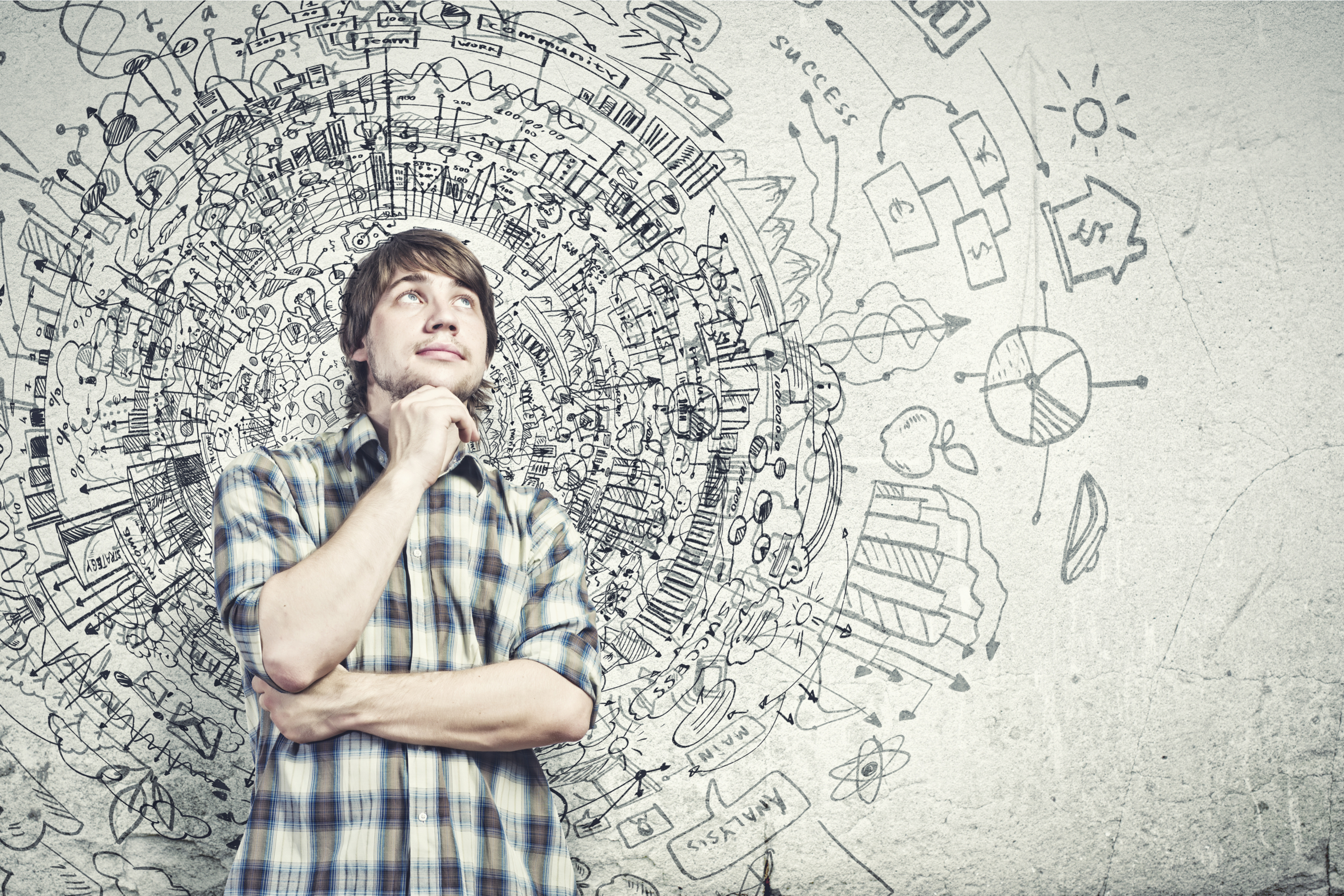 Young man thinking innovatively