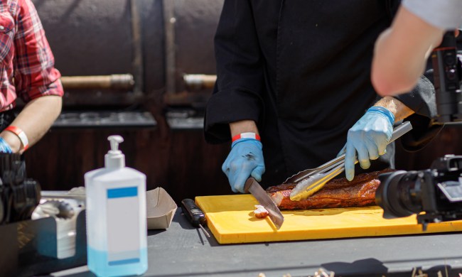 restaurant health code violations chef slicing delicious bbq meat at street market on table