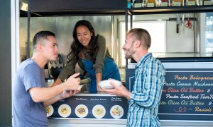 Two people at a food truck