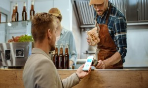 Food truck employee at work with a customer