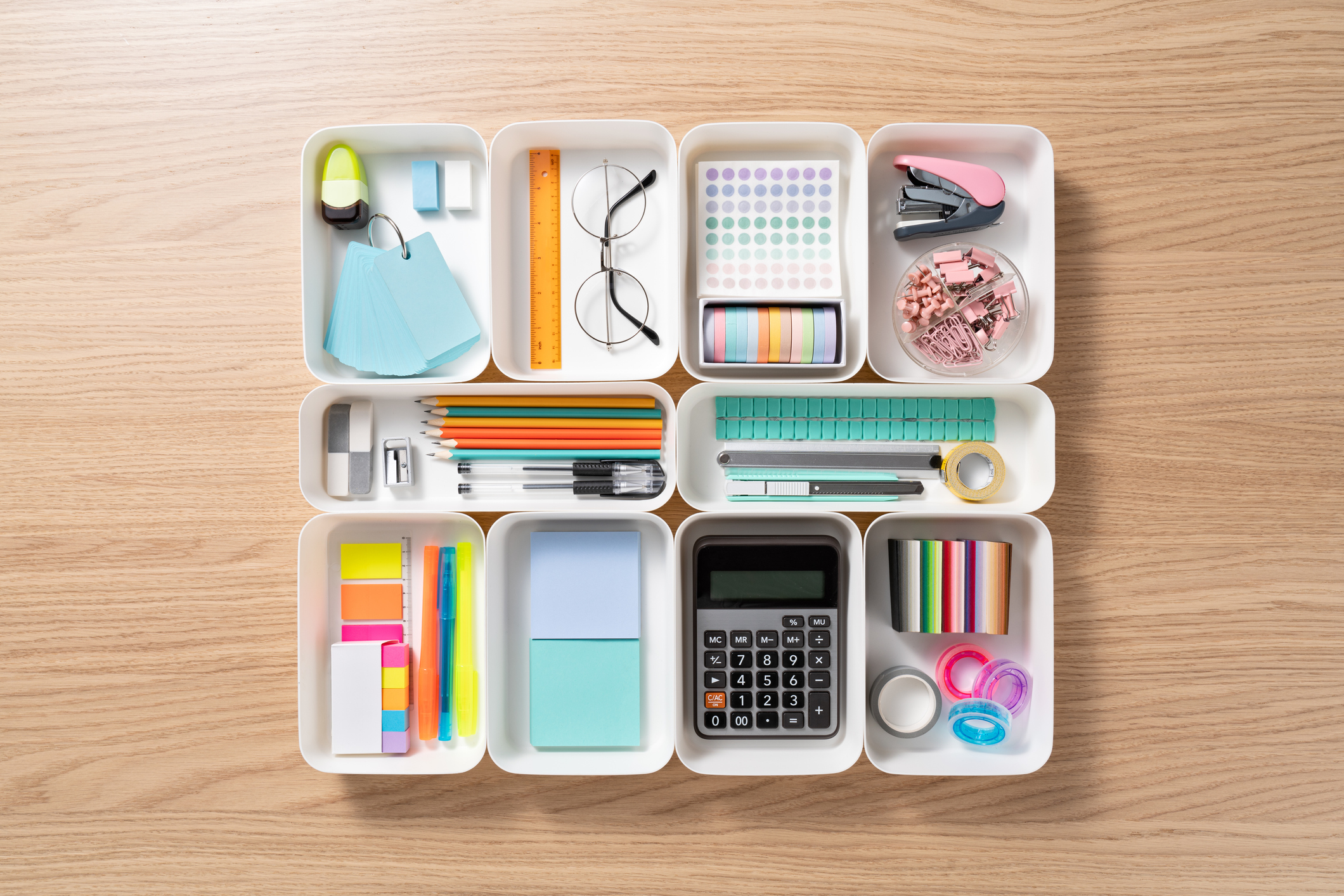 Neatly organized office accessories in desk organizer trays