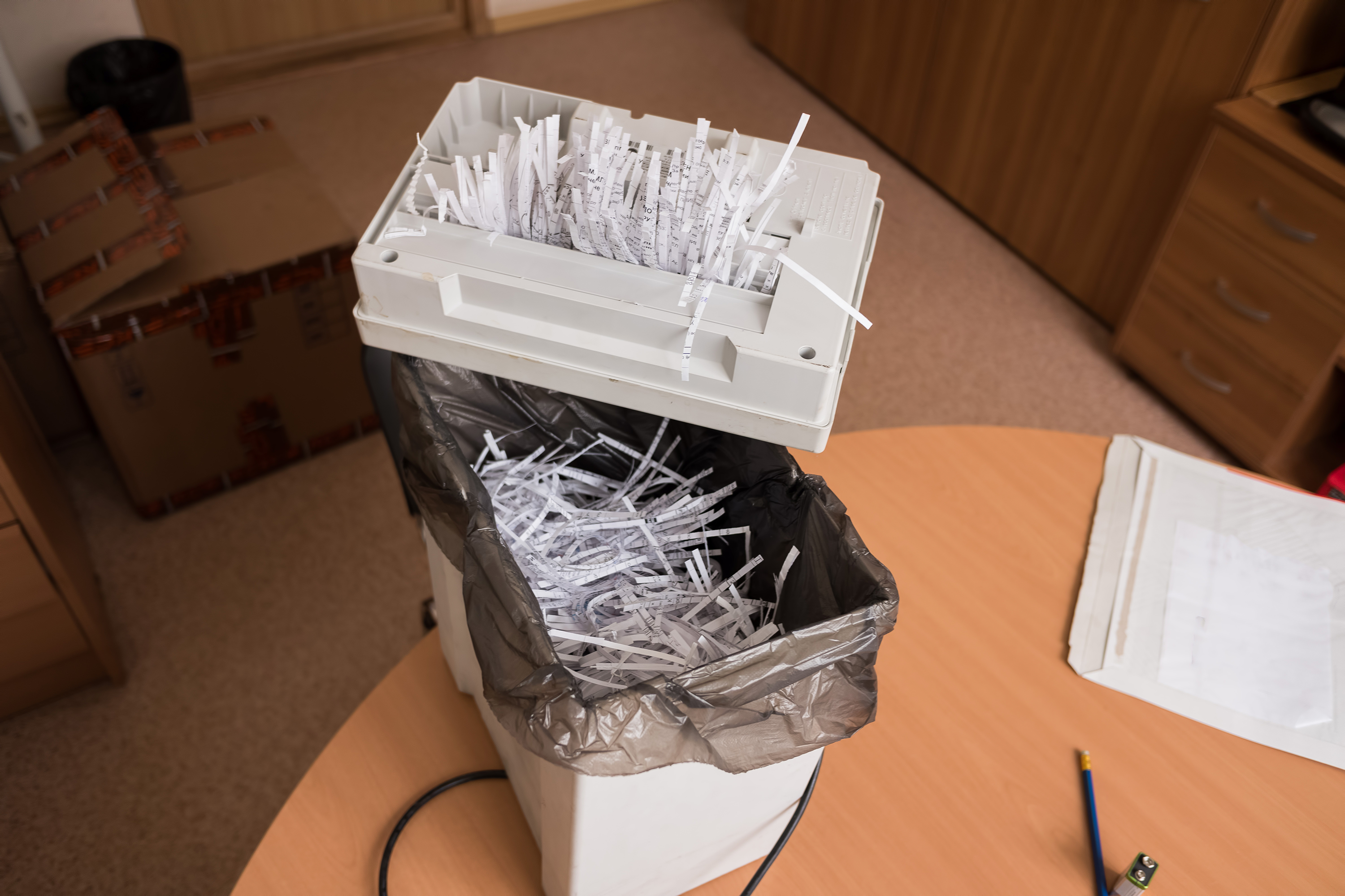 Small paper shredder on a wastebasket