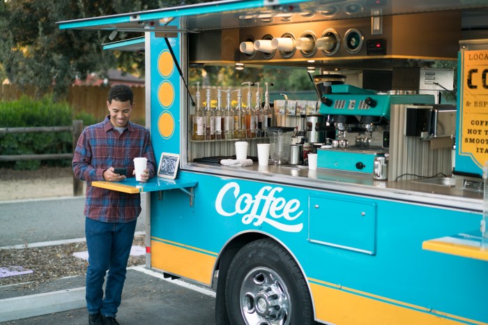 Customer drinking coffee by a food truck